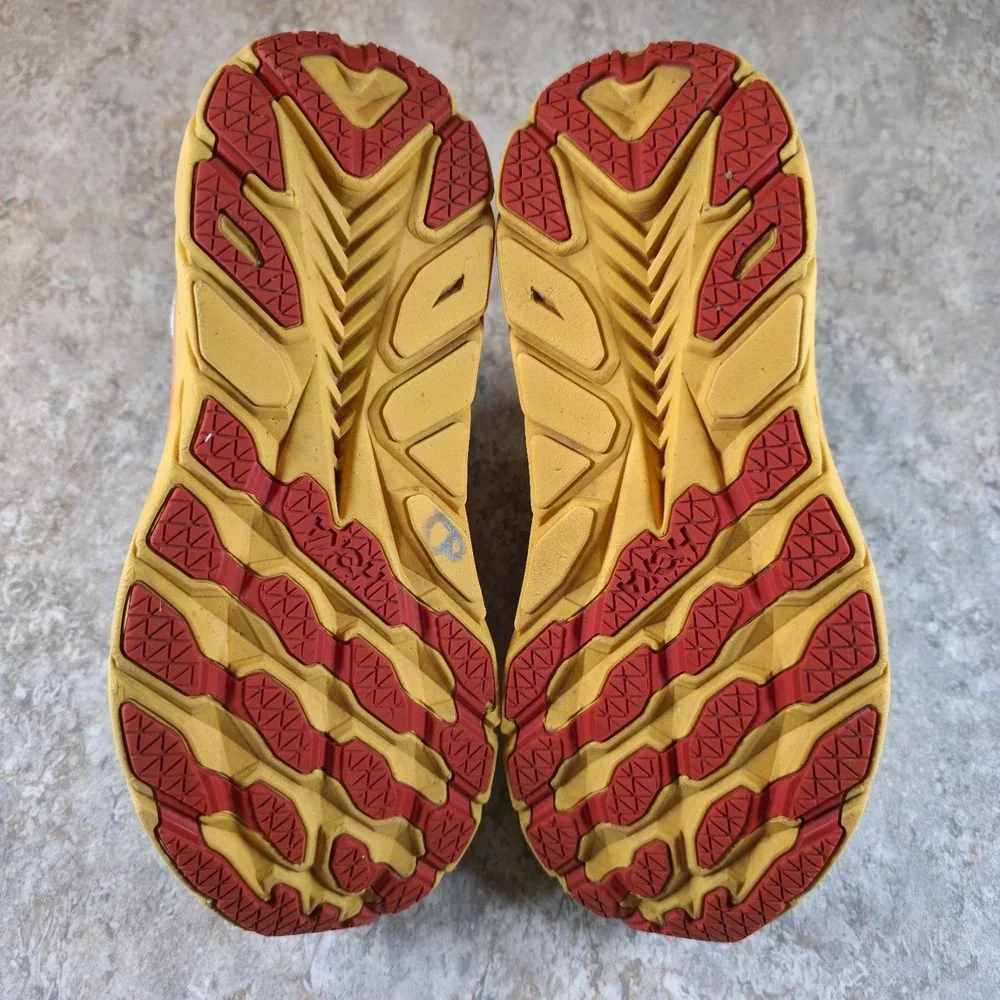 Hoka One One Women's Light Blue Running Shoes with Yellow and Orange Midsole